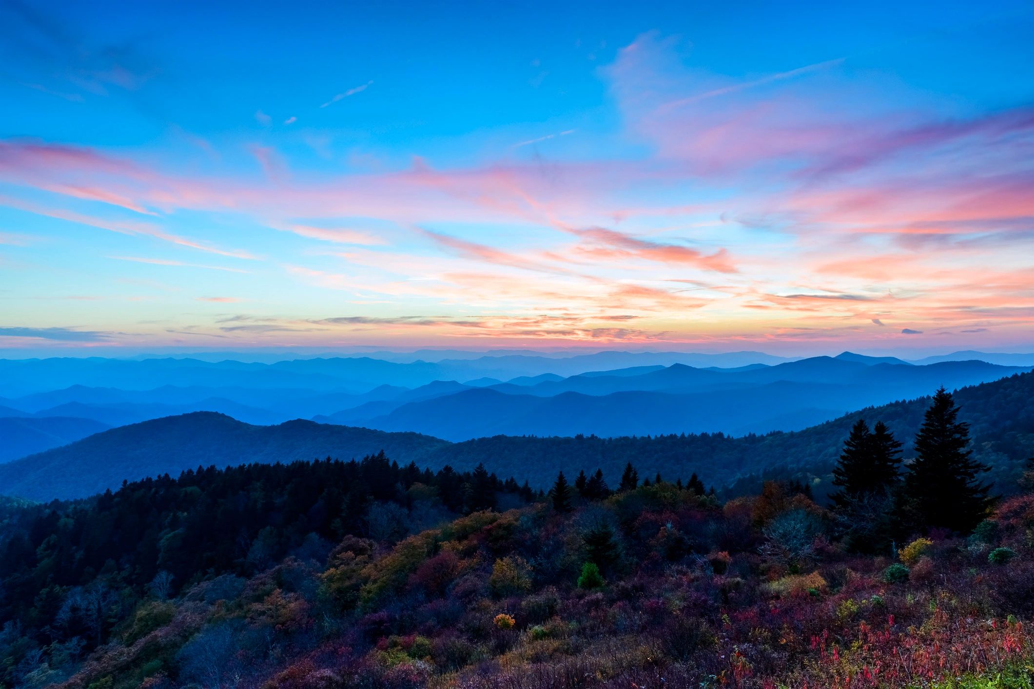 Mountain landscape at sunrise with peaceful sky