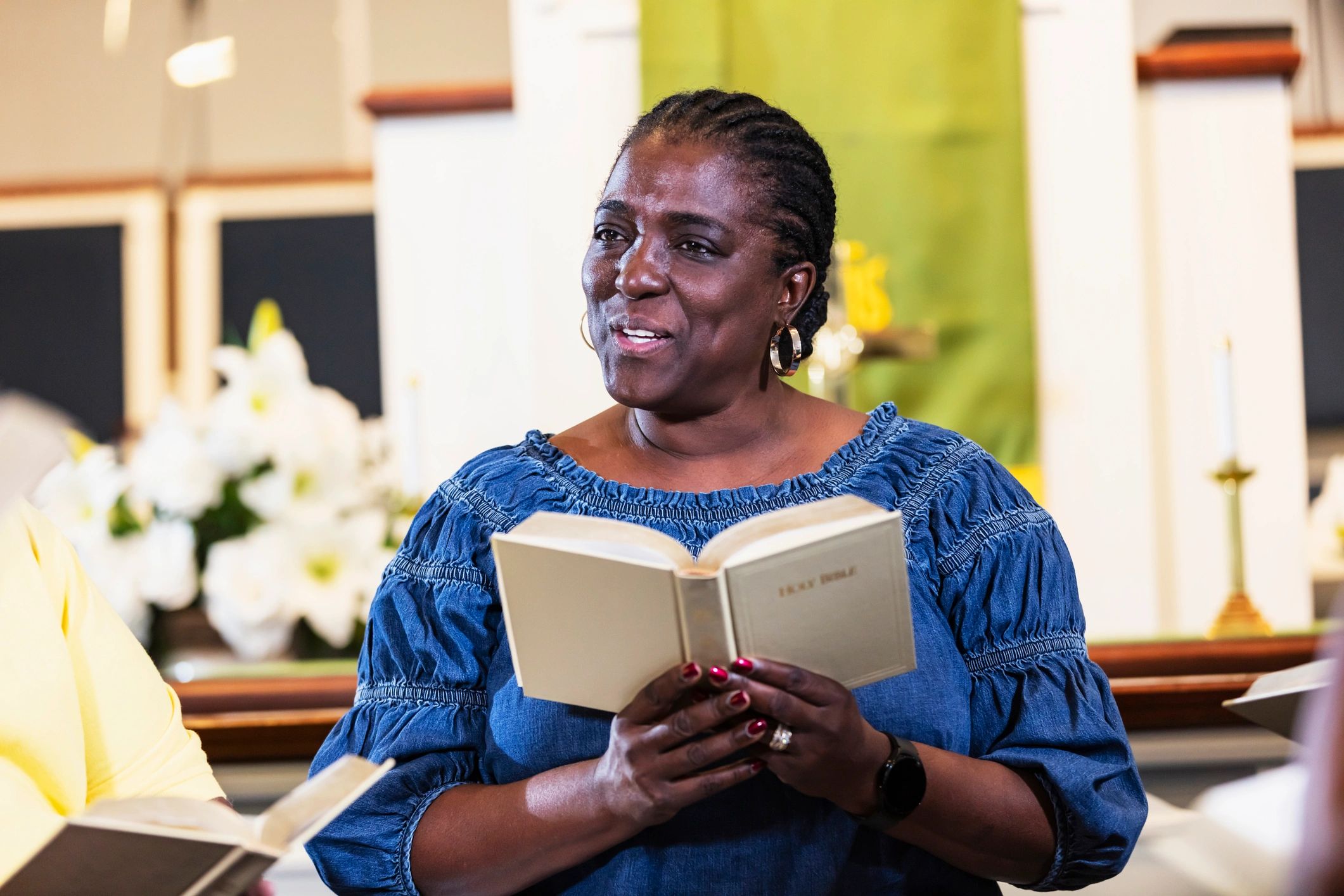 Mature woman attending Bible study with open Bible